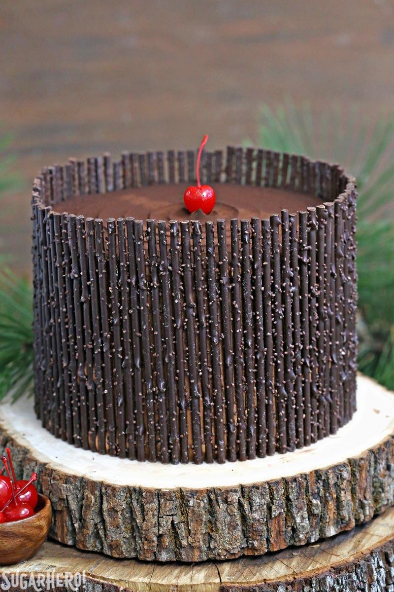 Black Forest Cake - the classic chocolate-cherry cake! Chocolate cake, cherry filling, and chocolate twigs! | From SugarHero.com