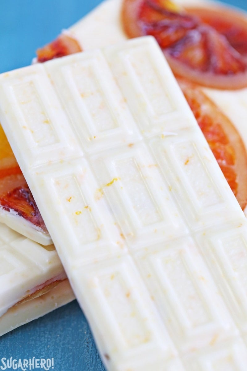 Candied Orange White Chocolate Bars - white chocolate bars with orange zest and candied oranges. Sweet, tart, and tangy! | From SugarHero.com