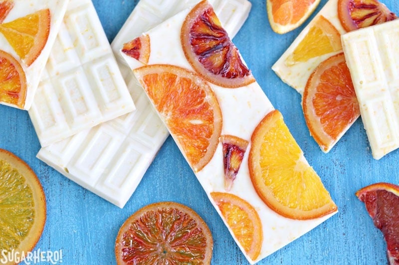 Candied Orange White Chocolate Bars - white chocolate bars with orange zest and candied oranges. Sweet, tart, and tangy! | From SugarHero.com