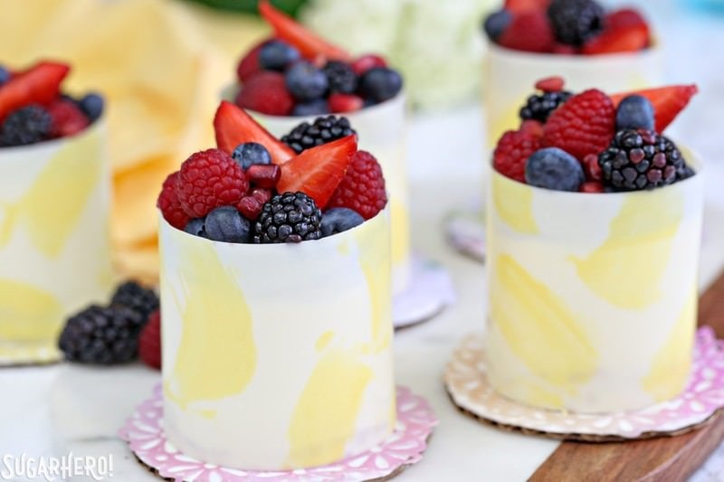 Lemon Mousse Cakes in White Chocolate Shells - lemon mousse in gorgeous painted white chocolate shells! | From SugarHero.com