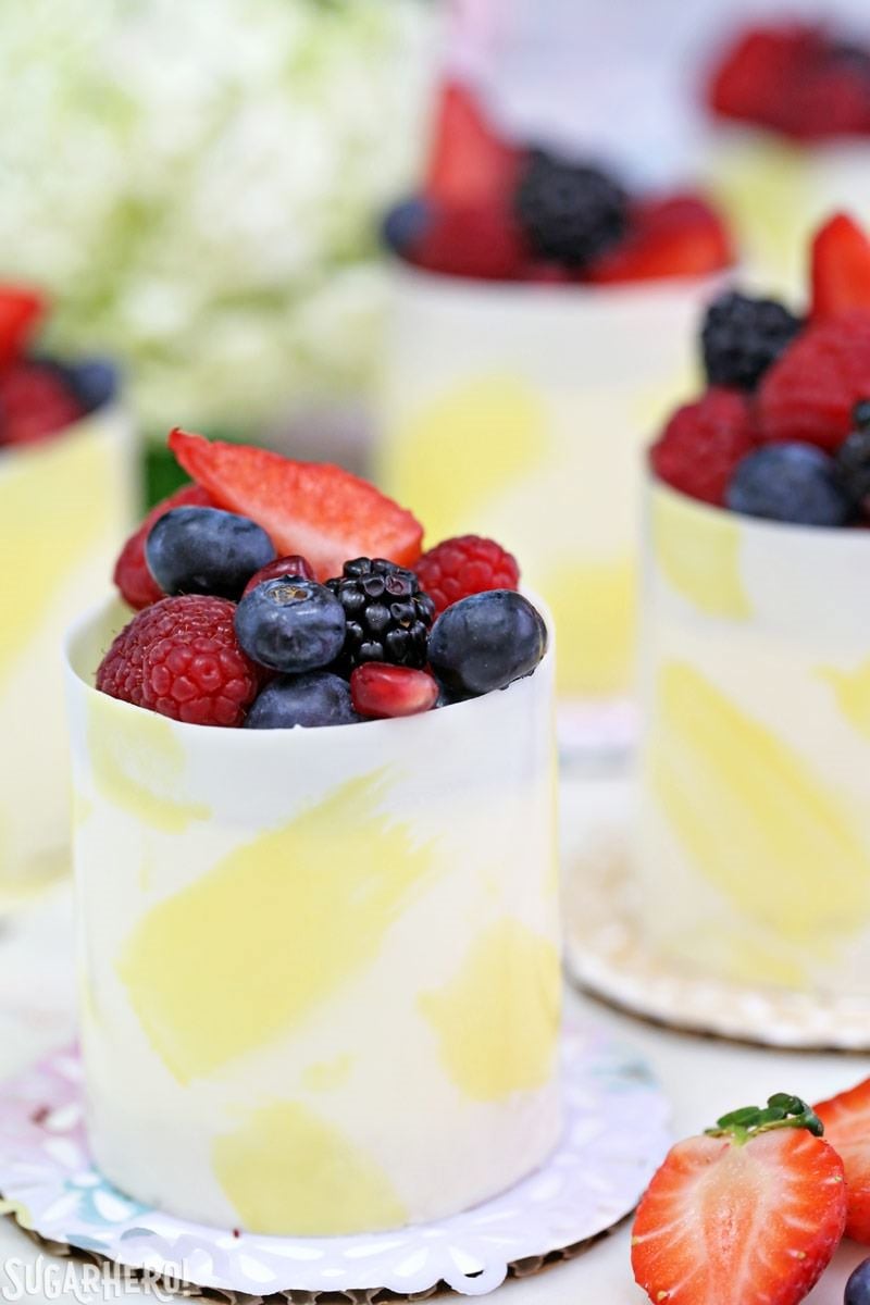 Lemon Mousse Cakes in White Chocolate Shells - lemon mousse in gorgeous painted white chocolate shells! | From SugarHero.com