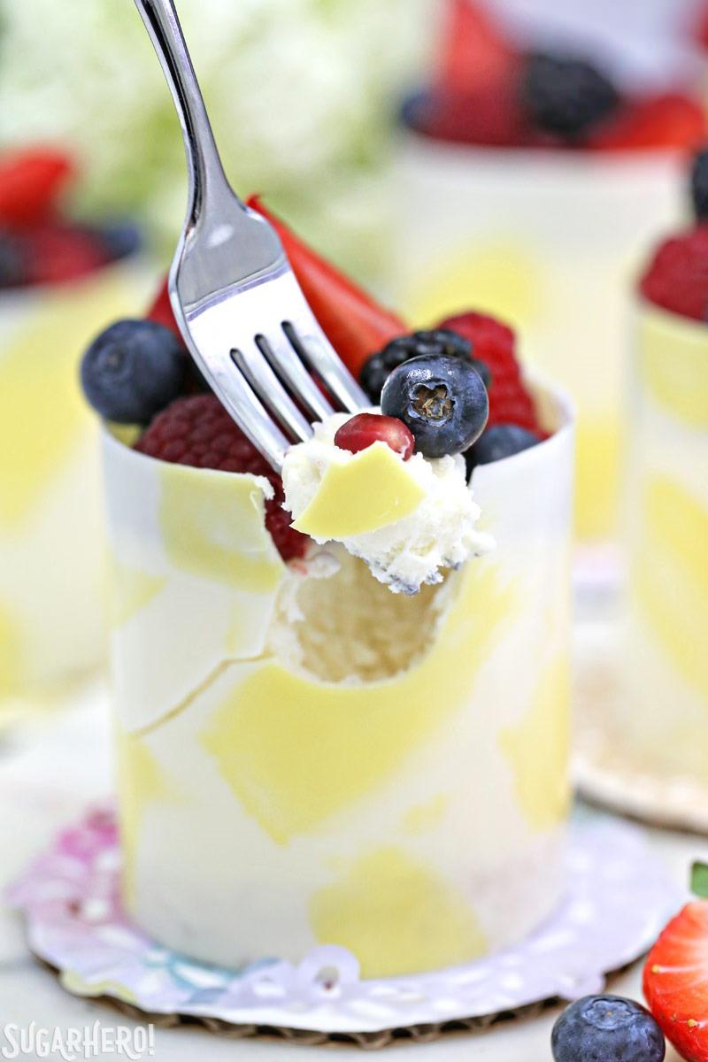 Lemon Mousse Cakes in White Chocolate Shells - lemon mousse in gorgeous painted white chocolate shells! | From SugarHero.com