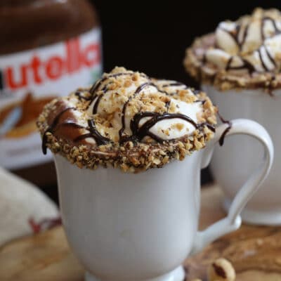 Close up of a white mug full of Nutella Hot Chocolate.