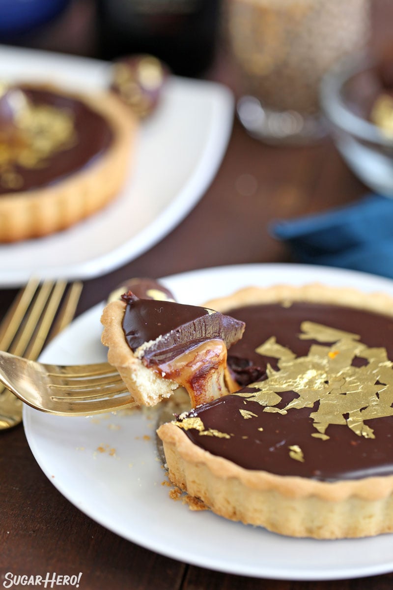 Close-up of fork taking a bite out of a Baileys Chocolate Caramel Tart