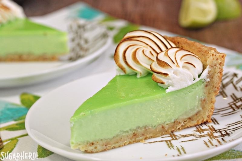 Toasted Coconut Lime Meringue Tart - with a tangy lime filling and toasted meringue on top! | From SugarHero.com