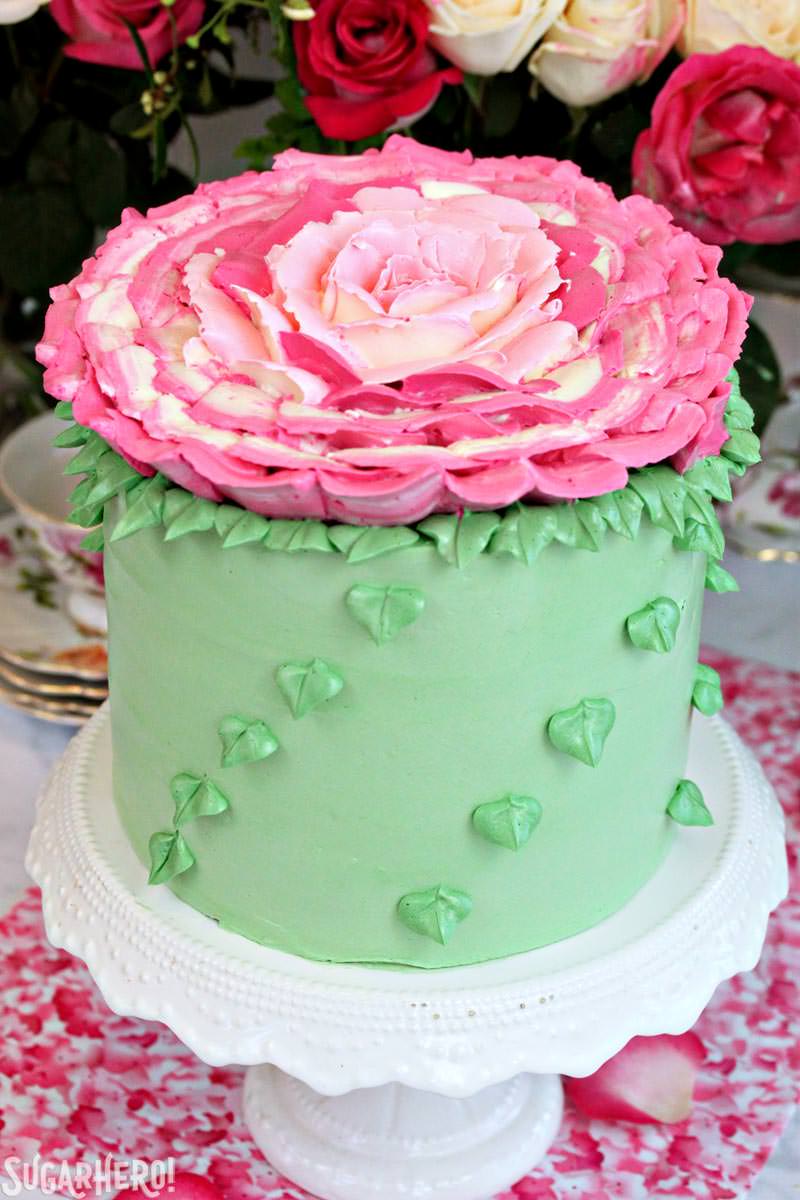 Giant Rose Cake - a gorgeous four-layer cake topped with a huge buttercream rose! | From SugarHero.com