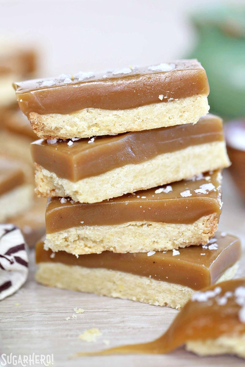 Salted Caramel Bars - buttery shortbread, soft and chewy caramel, and crunchy sea salt! | From SugarHero.com Salted Caramel Bars - great when dunked in chocolate, but also delicious when eaten plain! | From SugarHero.com