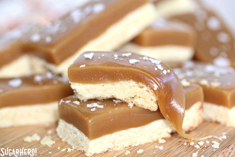 Salted Caramel Bars - buttery shortbread, soft and chewy caramel, and crunchy sea salt! | From SugarHero.com