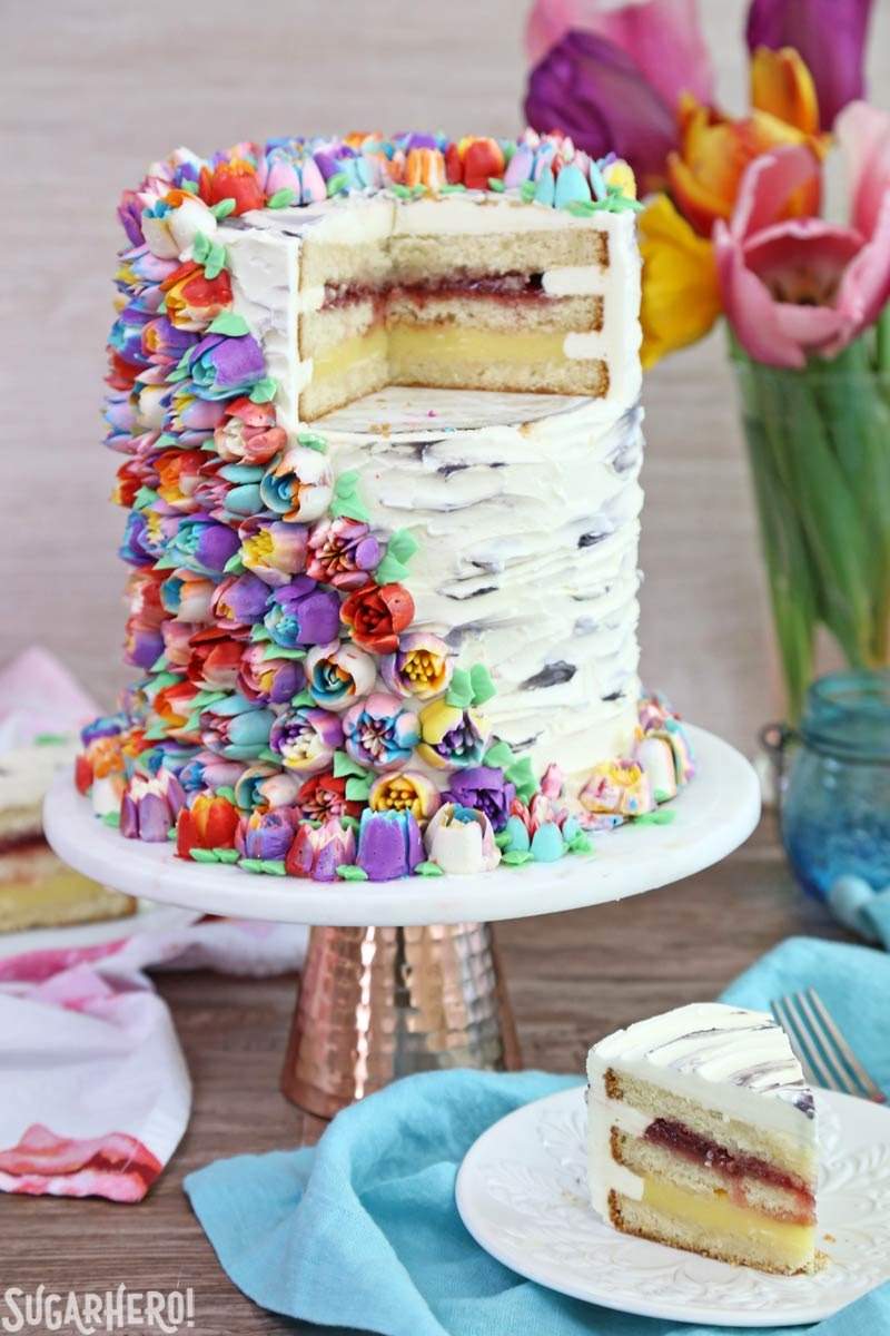 Spring In Bloom Layer Cake - an extra-tall cake covered in Russian Piping Tip flowers | From SugarHero.com