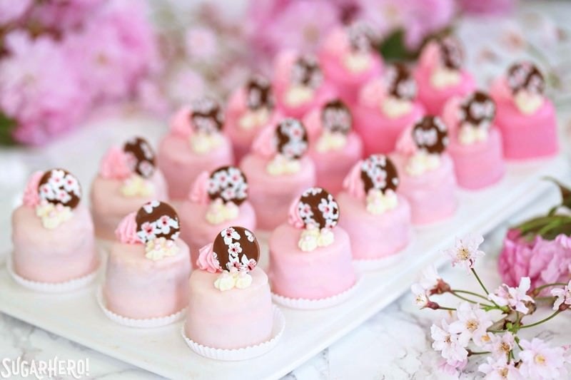 Cherry Blossom Petit Fours - cute little cake bites filled with cherry buttercream and jam! | From SugarHero.com Cherry Blossom Petit Fours - cute little cake bites filled with cherry buttercream and jam! | From SugarHero.com