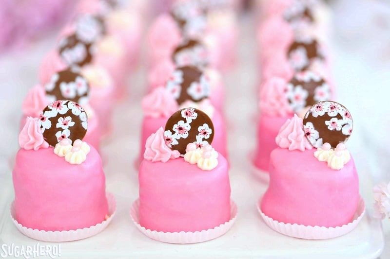Cherry Blossom Petit Fours - cute little cake bites filled with cherry buttercream and jam! | From SugarHero.com