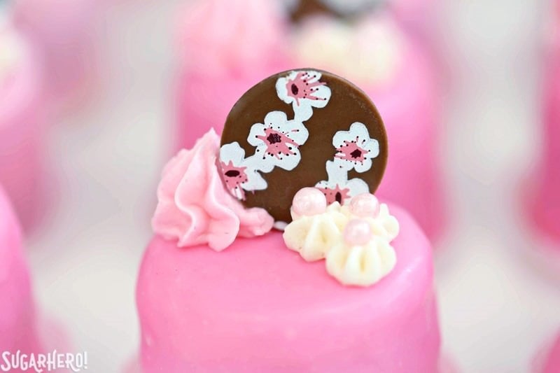 Cherry Blossom Petit Fours - cute little cake bites filled with cherry buttercream and jam! | From SugarHero.com Cherry Blossom Petit Fours - cute little cake bites filled with cherry buttercream and jam! | From SugarHero.com