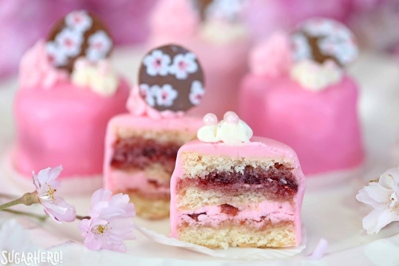 Cherry Blossom Petit Fours - cute little cake bites filled with cherry buttercream and jam! | From SugarHero.com Cherry Blossom Petit Fours - cute little cake bites filled with cherry buttercream and jam! | From SugarHero.com