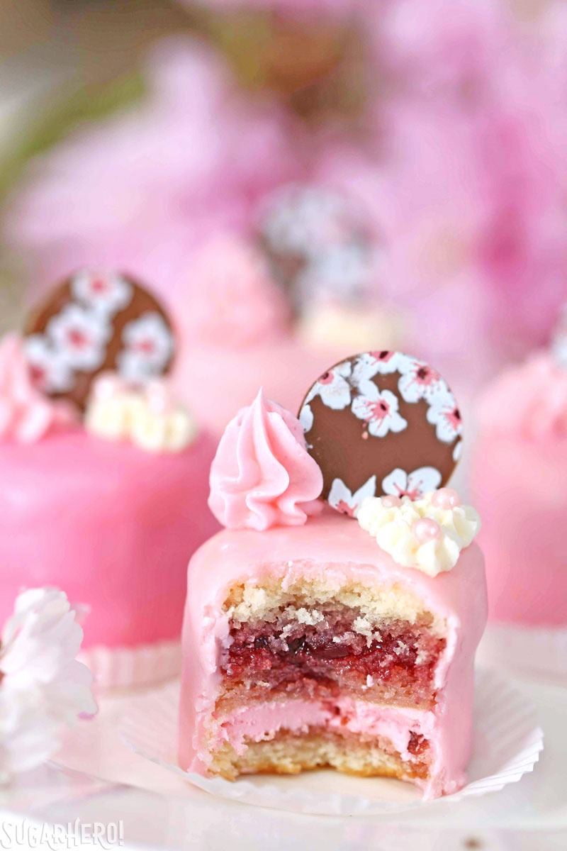 Cherry Blossom Petit Fours - cute little cake bites filled with cherry buttercream and jam! | From SugarHero.com Cherry Blossom Petit Fours - cute little cake bites filled with cherry buttercream and jam! | From SugarHero.com