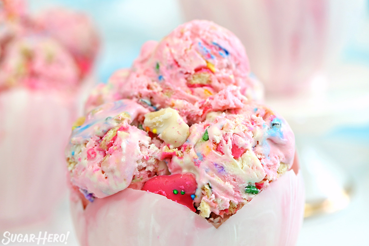 Circus Animal No-Churn Ice Cream - pink and white swirled ice cream in edible white chocolate bowls! | From SugarHero.com