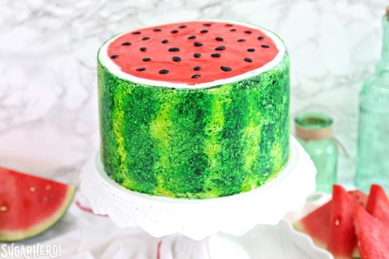 Watermelon Layer Cake - a fun cake that looks AND tastes like a watermelon! | From SugarHero.com Watermelon Layer Cake - a fun cake that looks AND tastes like a watermelon! | From SugarHero.com