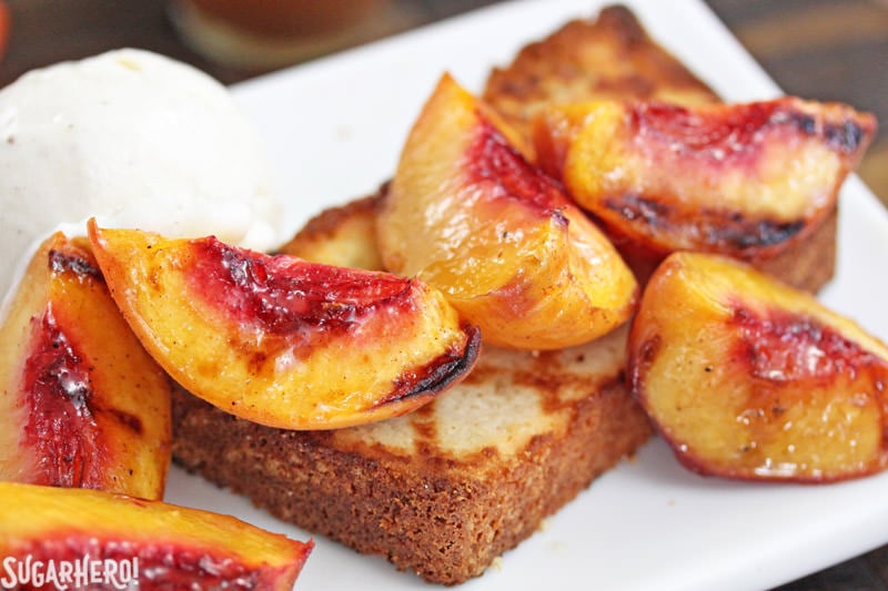 Grilled Pound Cake and Peaches - an easy summer dessert with honey-cinnamon caramel sauce! | From SugarHero.com Grilled pound cake with grilled peaches and vanilla ice cream | From SugarHero.com