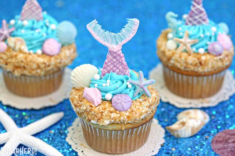 Mermaid Cupcakes - gorgeous under-the-sea cupcakes with edible mermaid tails and chocolate seashells! | From SugarHero.com