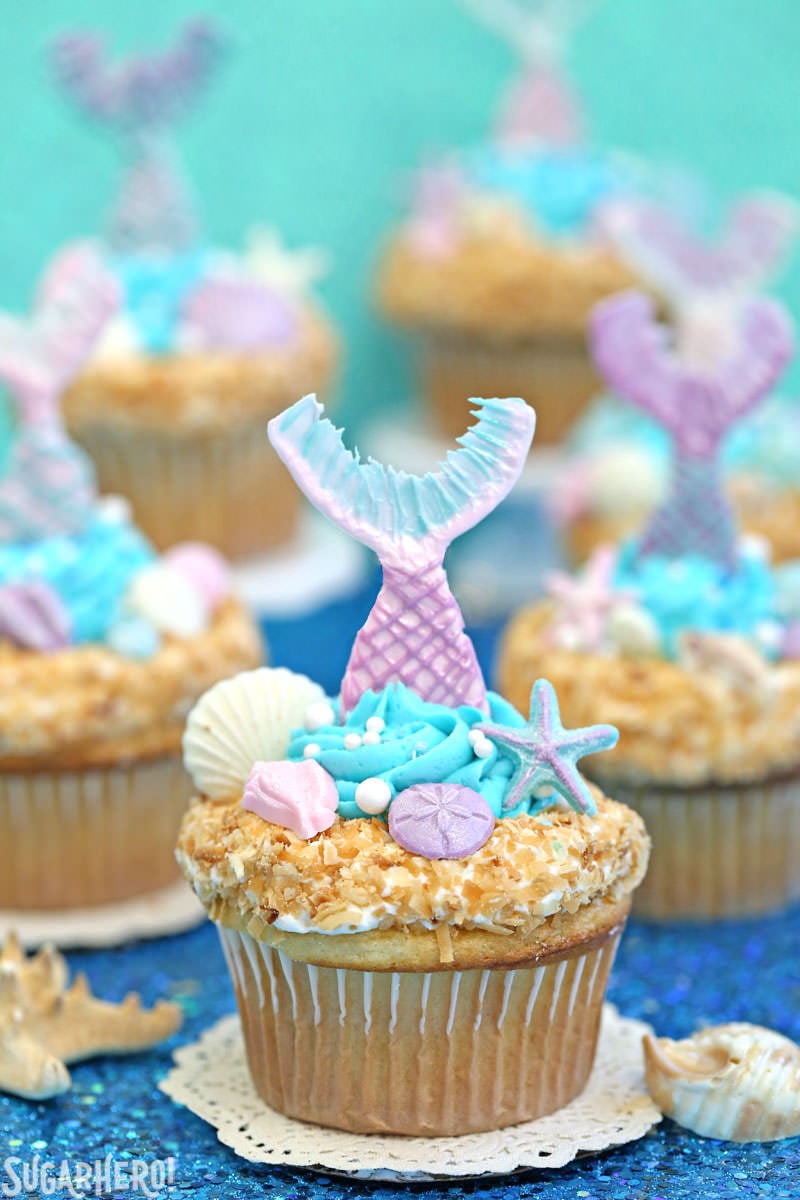 Mermaid Cupcakes - gorgeous under-the-sea cupcakes with edible mermaid tails and chocolate seashells! | From SugarHero.com