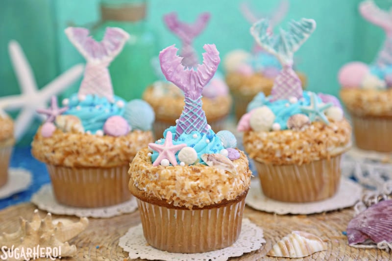 Mermaid Cupcakes - a grouping of gorgeous mermaid cupcakes, with chocolate mermaid tails | From SugarHero.com