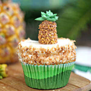 Pineapple Cupcakes with Coconut Frosting | From SugarHero.com