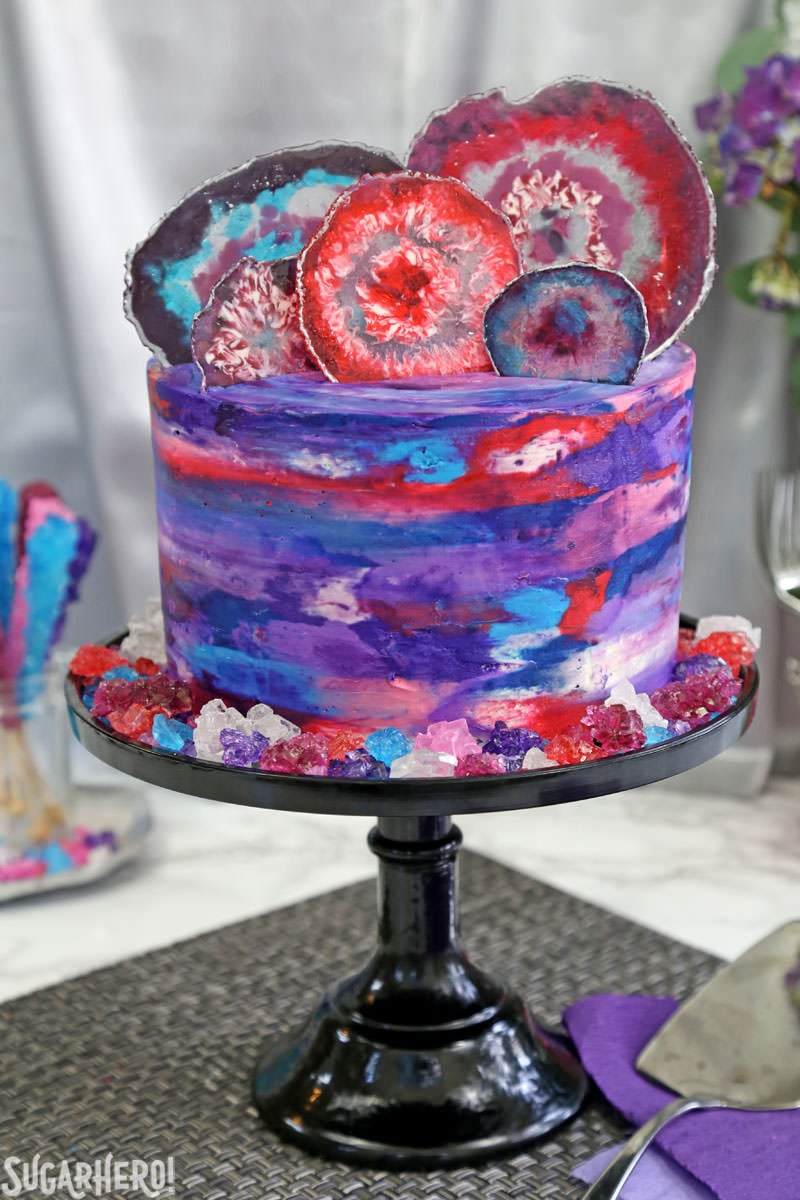 Agate Cake - purple, blue, and pink watercolor cake with edible candy agate slices on top | From SugarHero.com