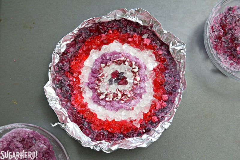 Agate Cake - with gorgeous, EDIBLE candy agate slices, and a pretty watercolor buttercream effect! | From SugarHero.com Crushed candy used to make candy agate slices that go on top of an Agate Cake | From SugarHero.com