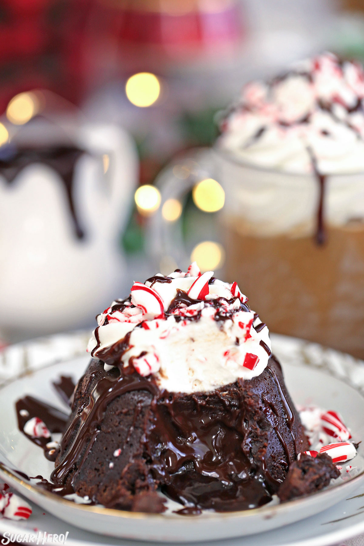 Peppermint Mocha Lava Cakes - close-up of lava cake with chocolate oozing out of the center | From SugarHero.com