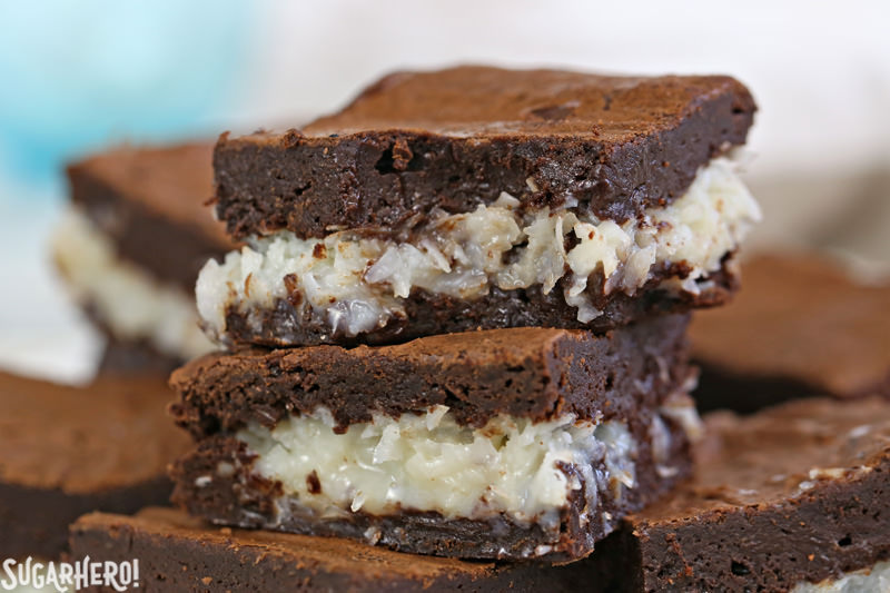 The BEST Coconut Brownies - close-up of gooey coconut brownie with a bite taken out of it | From SugarHero.com