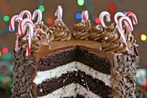 Chocolate Candy Cane Cake on a red platter with text title.