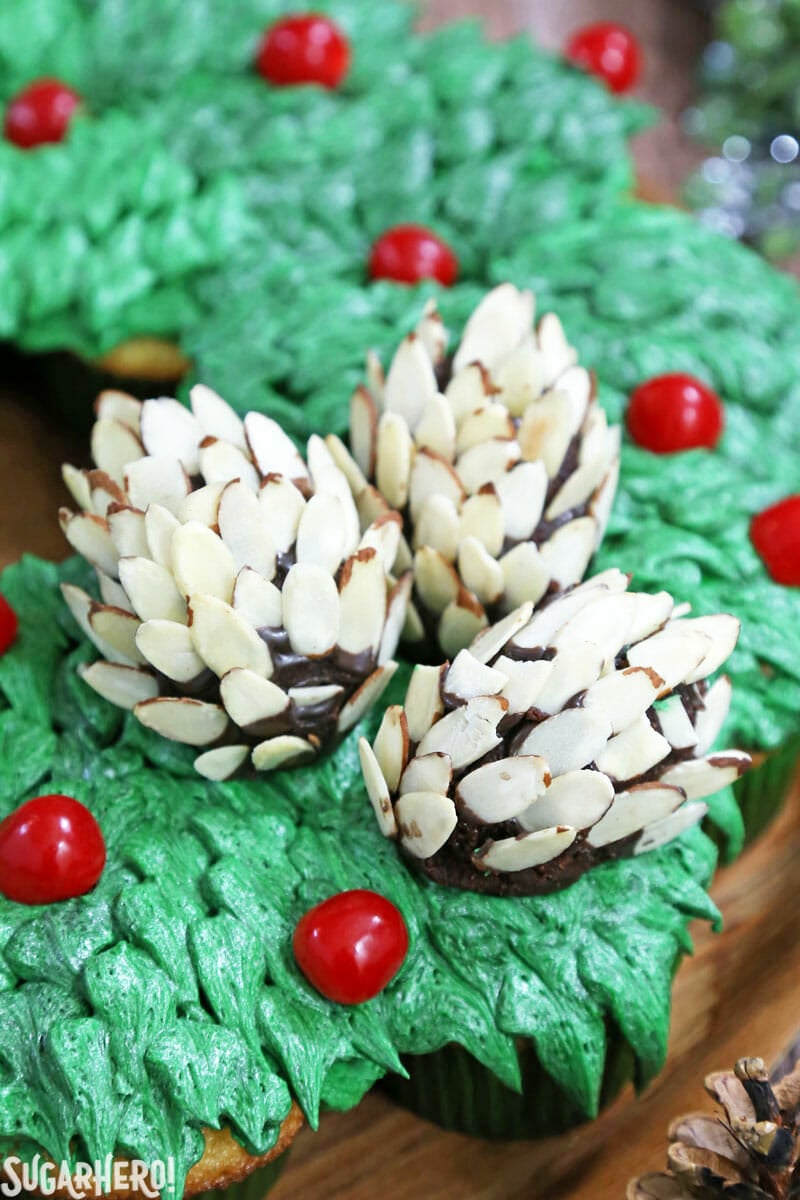 Pull-Apart Cupcake Wreath Cake - easy to make and feeds a holiday crowd! With cute edible pine cones on top. | From SugarHero.com Pull-Apart Cupcake Wreath Cake - close-up of the edible pine cones on top. | From SugarHero.com