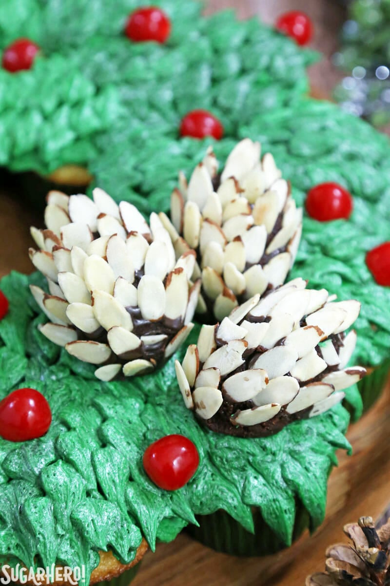 Pull-Apart Cupcake Wreath Cake - close-up of the edible pine cones on top. | From SugarHero.com