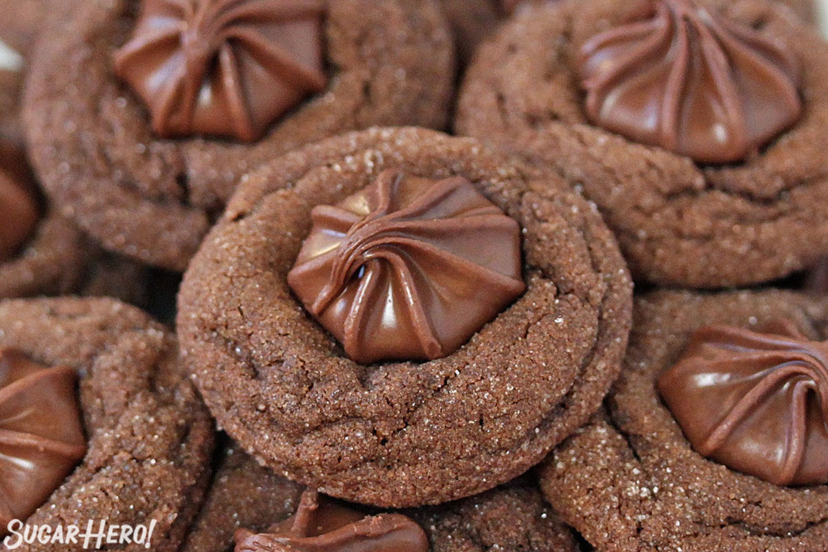 Soft Chocolate Gingerbread Cookies - cookies tumbling out of a gift box | From SugarHero.com
