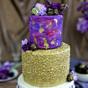 Close up of a Gold Sequin Watercolor Cake.