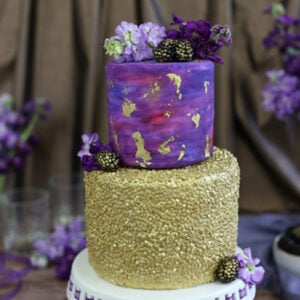 Close up of a Gold Sequin Watercolor Cake.