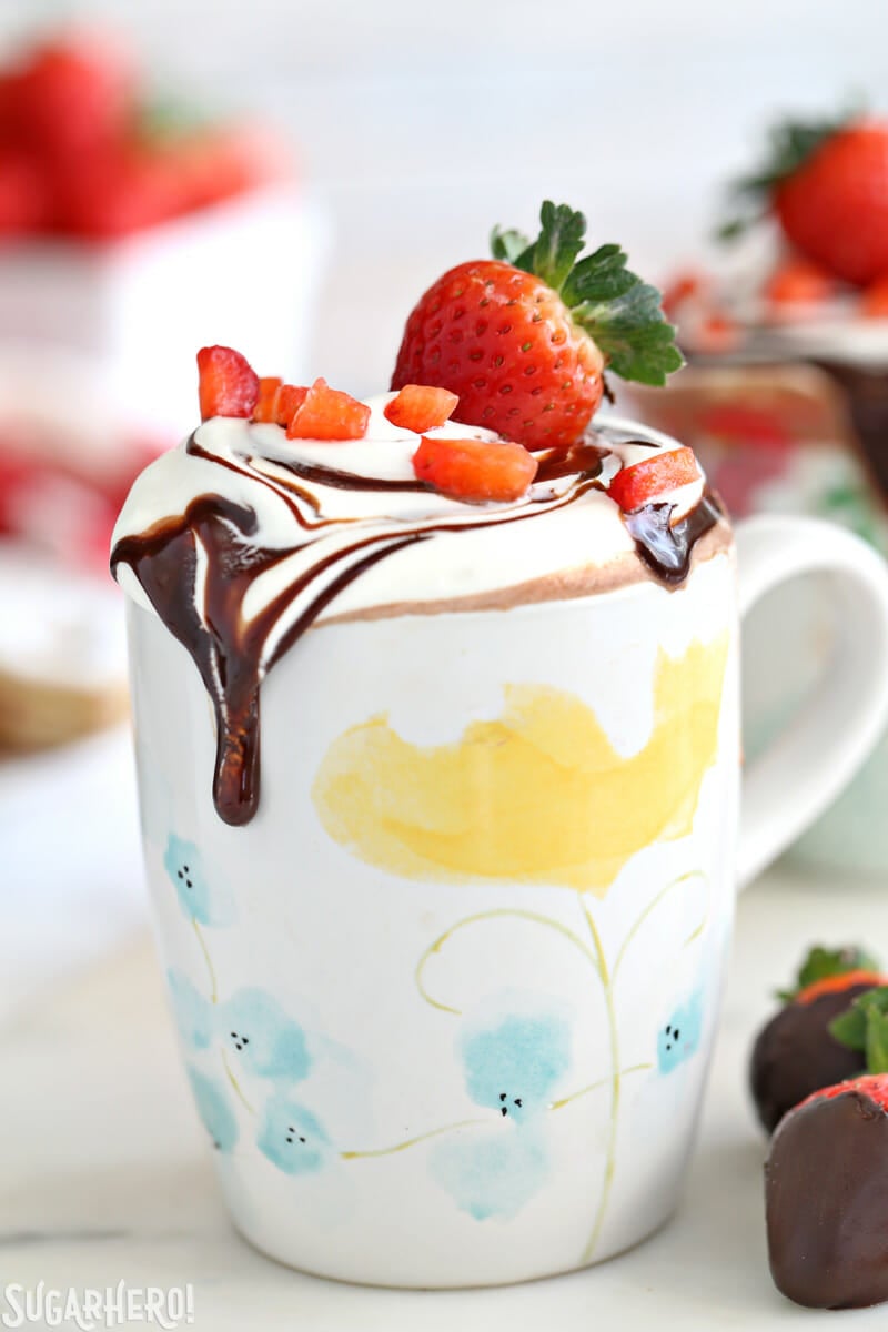 Strawberry Hot Chocolate - if you like chocolate-dipped strawberries, you'll love this recipe! Rich and creamy homemade hot chocolate with real strawberries blended right in. | From SugarHero.com