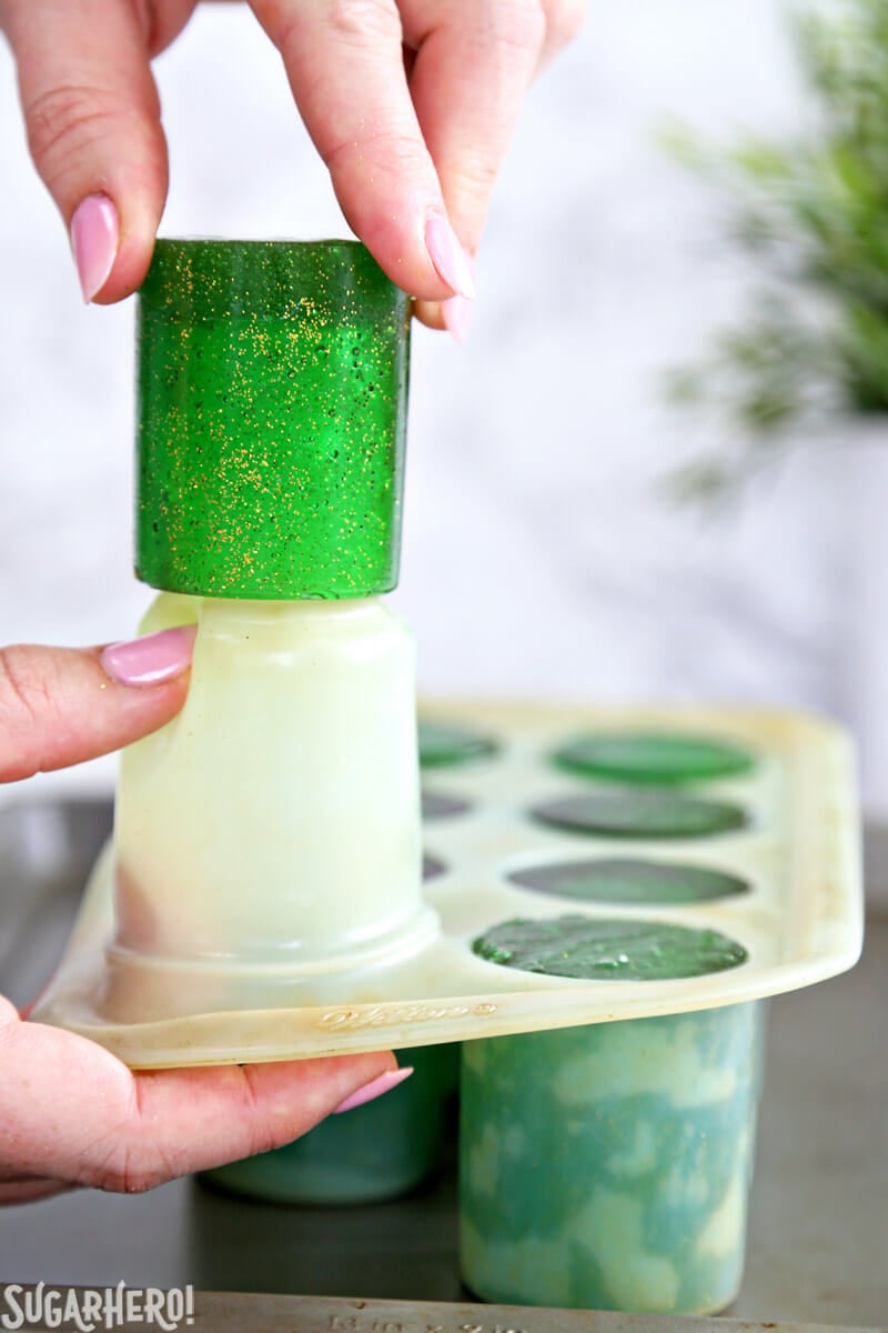 DIY Candy Shot Glasses - pulling a finished candy shot glass from the shot glass mold | From SugarHero.com