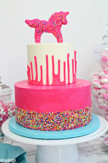 Close up of a Circus Animal Layer Cake on a blue plate.