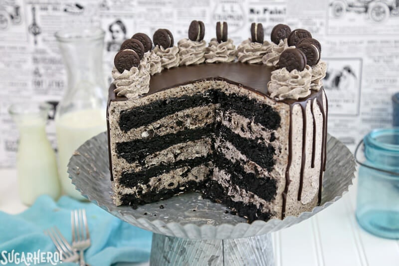 Cookies and Cream Cake - this epic cookies and cream layer cake will satisfy ALL of your chocolate cravings! It has rich devil's food cake plus buttercream with lots of cookie crumbs mixed right in. | From SugarHero.com Cookies and Cream Cake - cake with slices removed, showing inner cake layers | From SugarHero.com