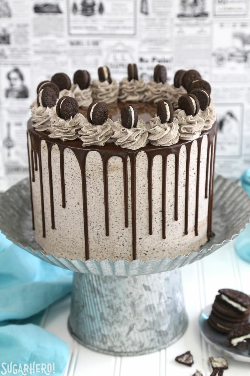 Cookies and Cream Cake - tall layer cake on a silver cake stand | From SugarHero.com