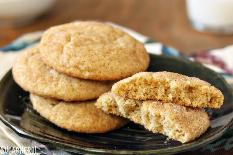 Snickerdoodle Cookies - close-up of snickerdoodle cookies with one broken in half | From SugarHero.com