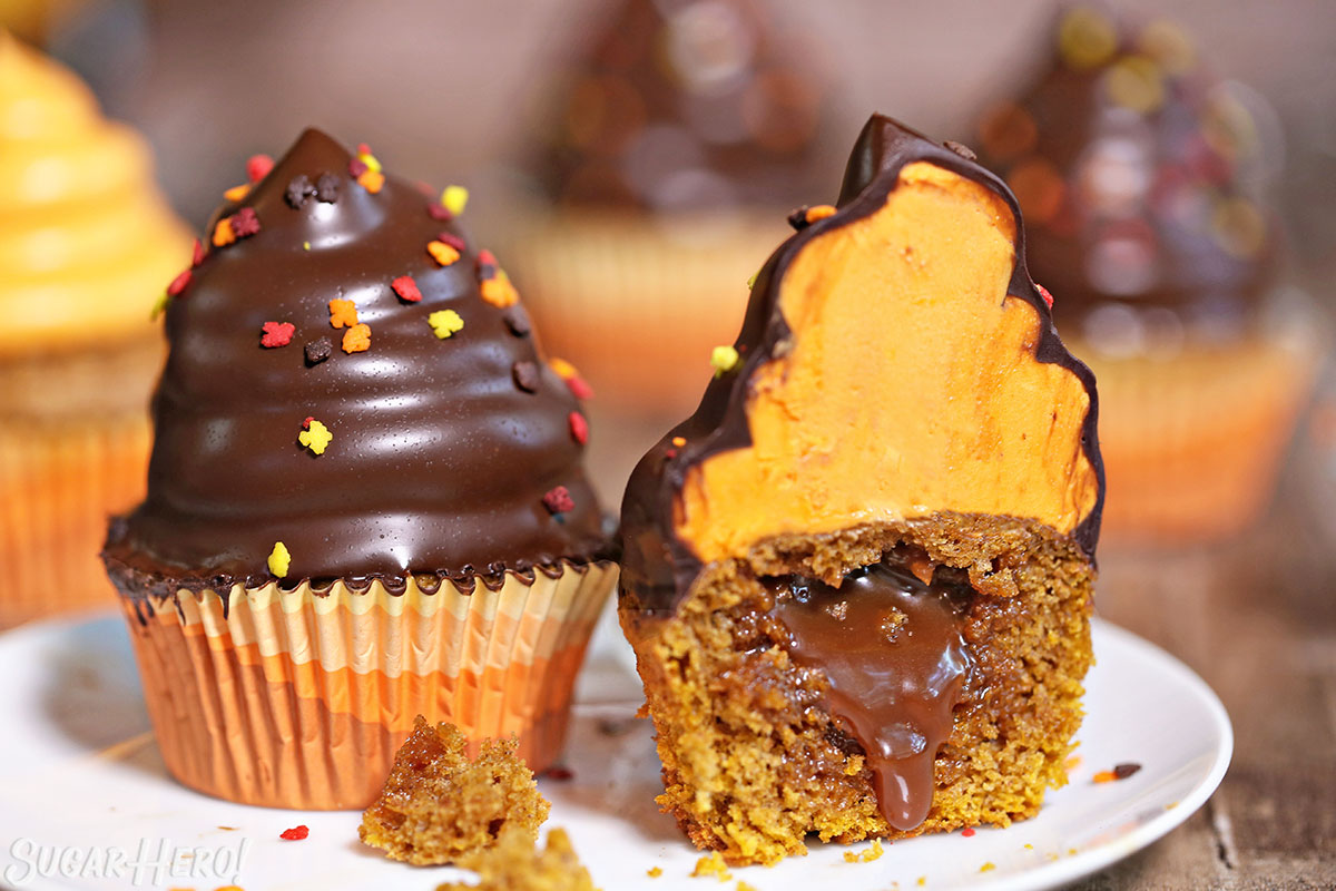 Pumpkin Spice Hi-Hat Cupcakes - A shot of the cupcake cut in half showing the inside. | From SugarHero.com