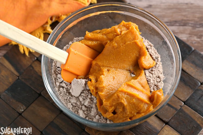 2-Ingredient Pumpkin Brownies - mixing pumpkin puree and brownie mix together | From SugarHero.com