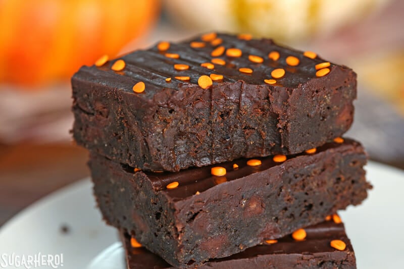 2-Ingredient Pumpkin Brownies - close-up of pumpkin brownies with a bite taken out | From SugarHero.com