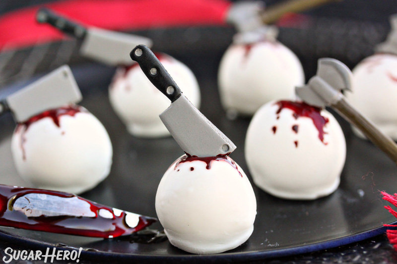 Bloody Truffles - group of bloody truffles on a black plate | From SugarHero.com