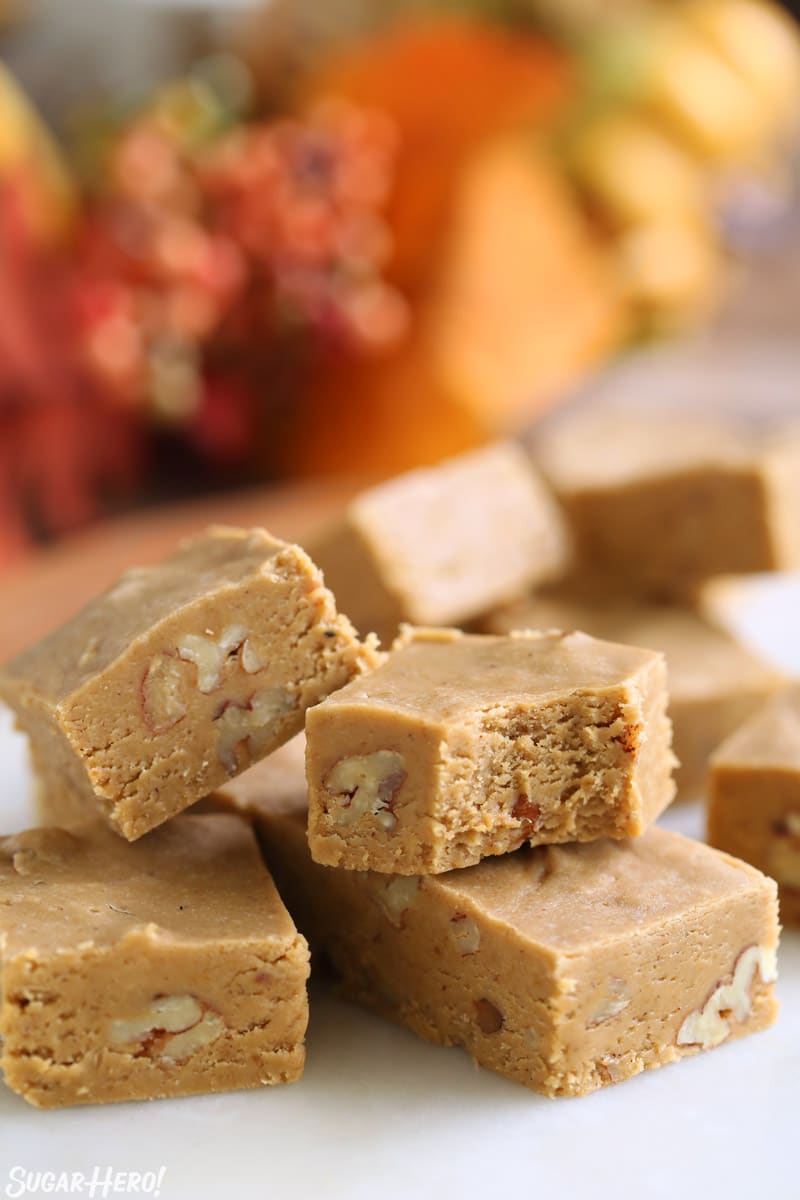 Pumpkin fudge stacked and showing the pecans inside each piece