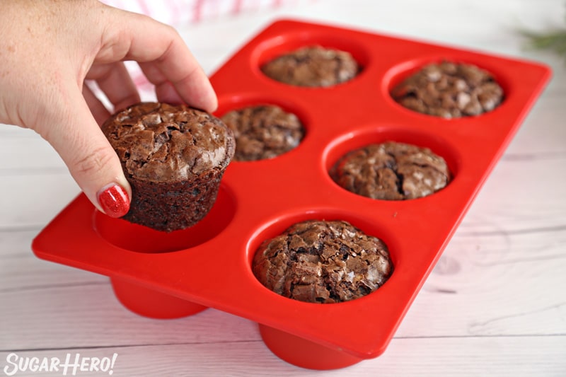 Blooming Chocolate Flowers - removing peppermint mocha brownie cups from a pan | From SugarHero.com
