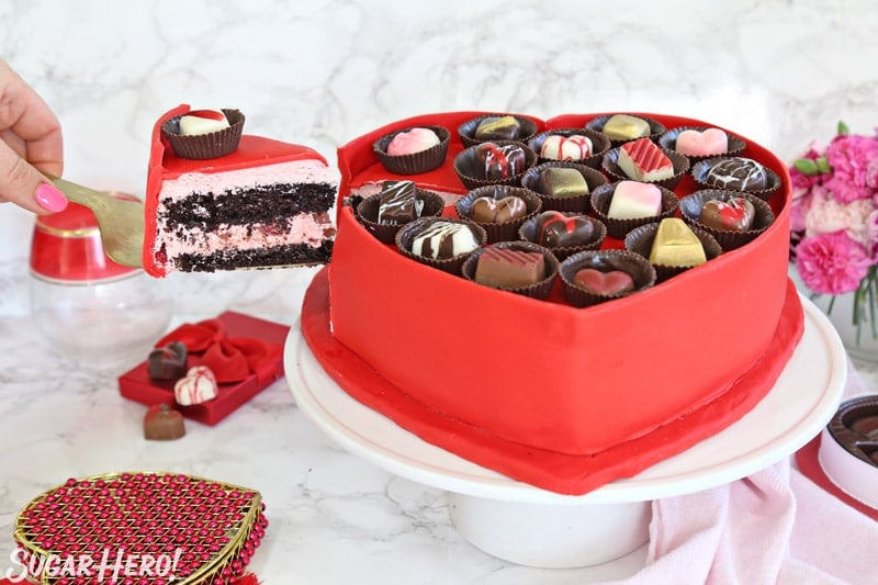 Box of Chocolates Cake - removing a slice of cake with a gold cake server | From SugarHero.com