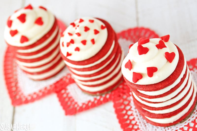 Red Velvet Icebox cakes - Three separate Icebox cakes with heart sprinkles on top | From SugarHero.com 