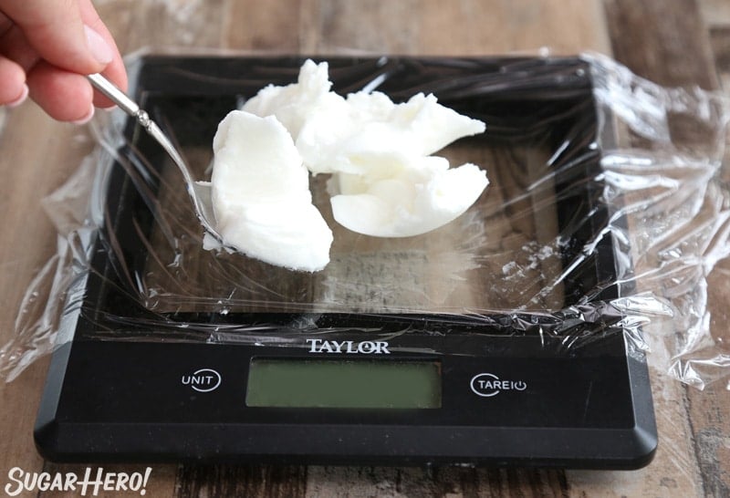How to Measure Shortening - Tips and Tricks for Measuring Shortening Easily | From SugarHero.com Spooning shortening onto a kitchen scale